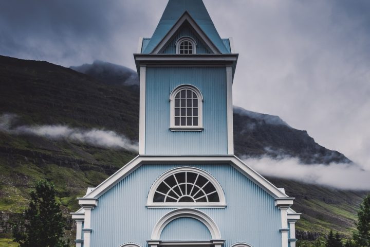 blue and white wooden church during daytime